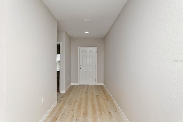 hall with light hardwood / wood-style floors