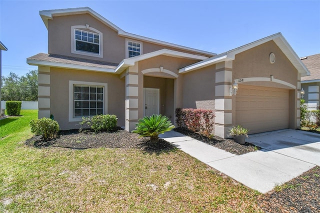 view of front facade with a front lawn and a garage