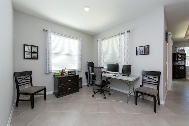 tiled home office featuring a wealth of natural light