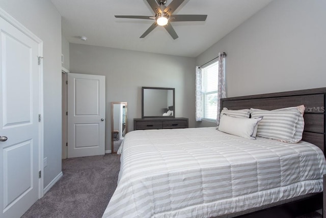 bedroom featuring dark colored carpet and ceiling fan