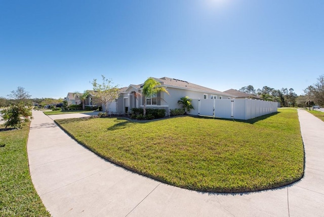 view of side of property featuring a yard