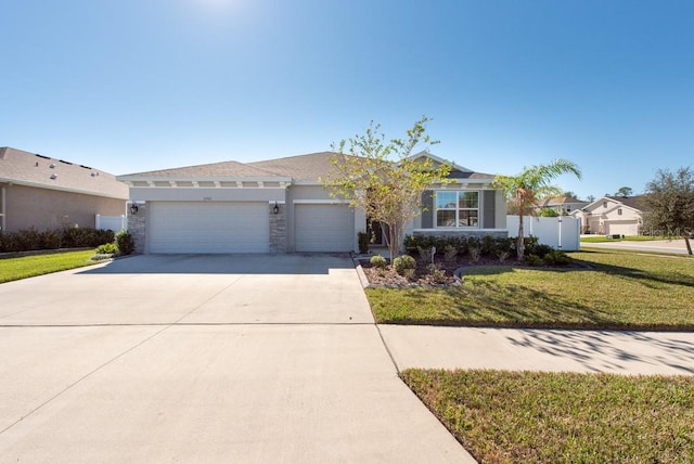 ranch-style house with a front yard and a garage