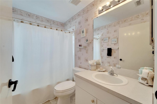 full bathroom with vanity, toilet, and shower / tub combo