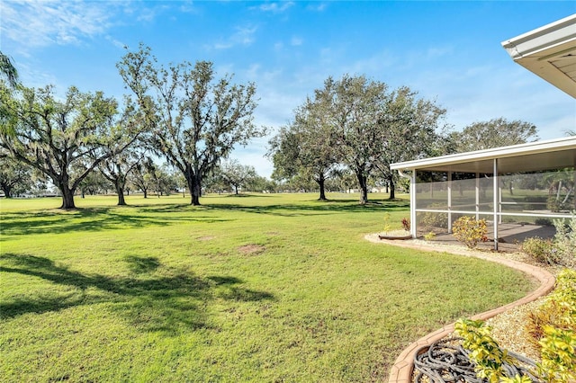 view of yard featuring a sunroom