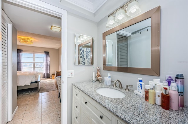 bathroom with tile patterned flooring and vanity