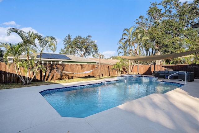 view of pool with outdoor lounge area and a patio area