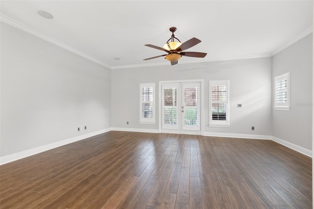 spare room with ceiling fan, dark hardwood / wood-style flooring, french doors, and crown molding