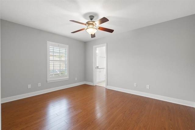 unfurnished room featuring ceiling fan and hardwood / wood-style flooring