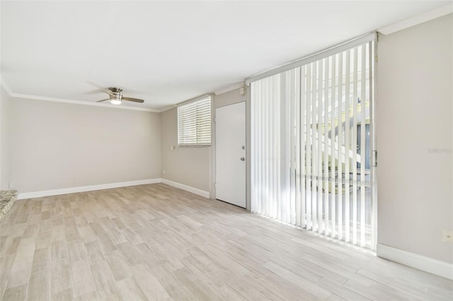 empty room featuring light hardwood / wood-style flooring, ceiling fan, and crown molding