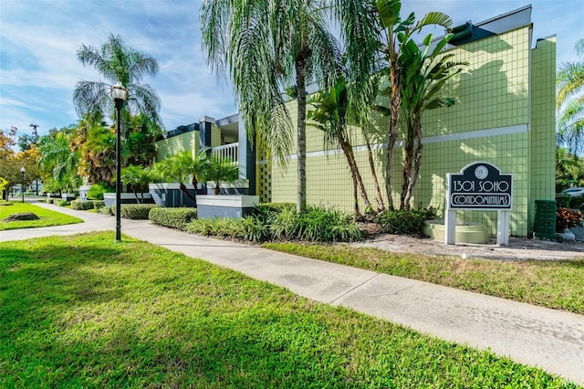 view of home's community with a lawn