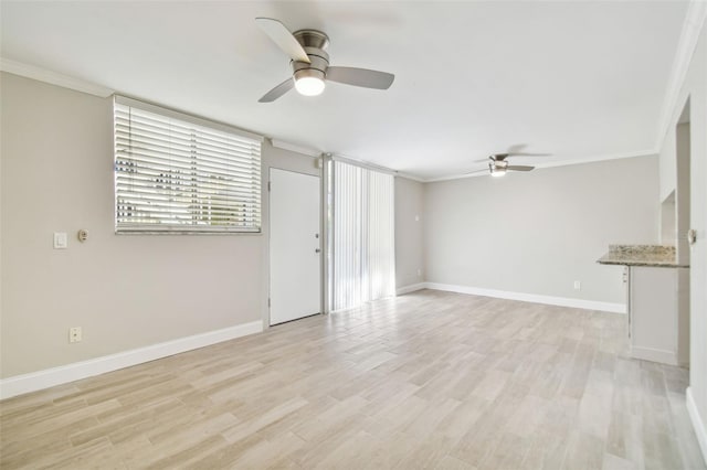 unfurnished living room featuring crown molding, ceiling fan, and light hardwood / wood-style floors