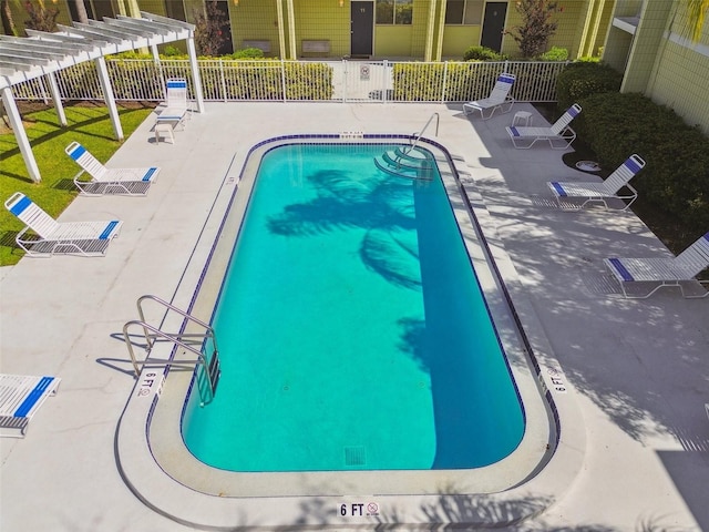 view of swimming pool featuring a pergola and a patio area