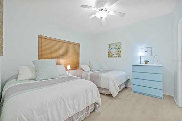 bedroom with ceiling fan and light hardwood / wood-style floors