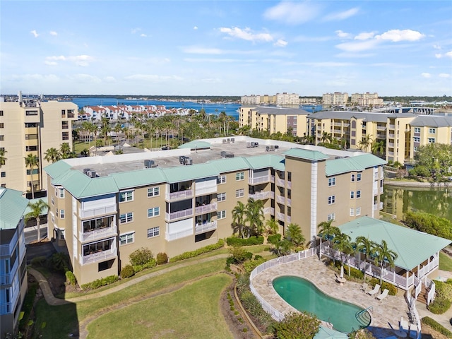 birds eye view of property with a water view