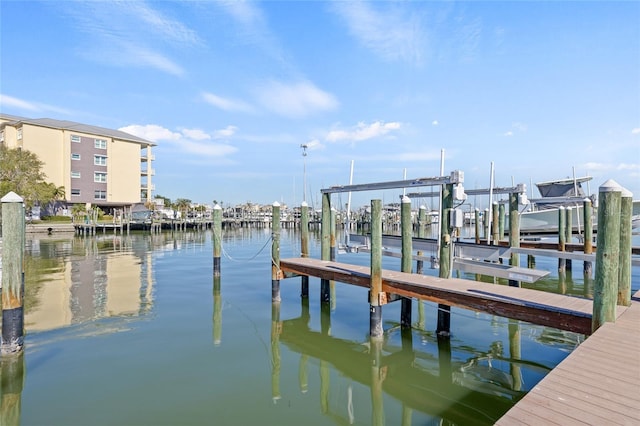 dock area featuring a water view and boat lift