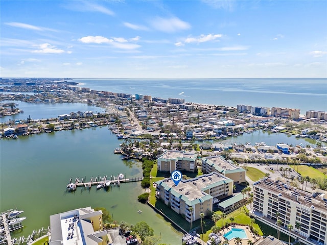 birds eye view of property with a view of city and a water view