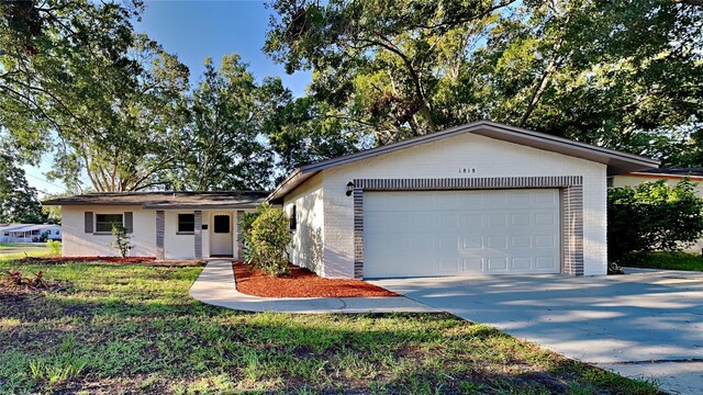 ranch-style home featuring a garage