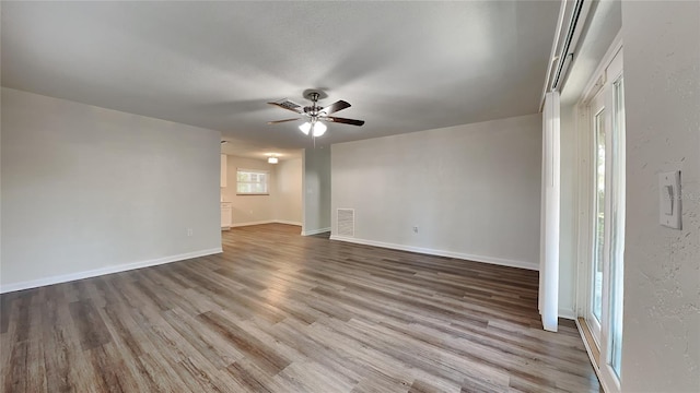 unfurnished room featuring ceiling fan and wood-type flooring