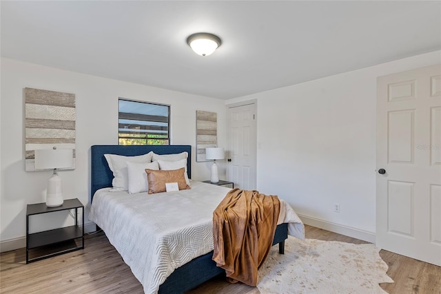 bedroom featuring wood-type flooring