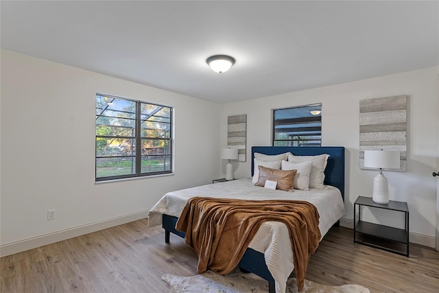 bedroom with light hardwood / wood-style floors