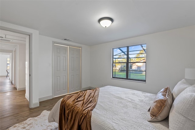 bedroom featuring hardwood / wood-style flooring and a closet