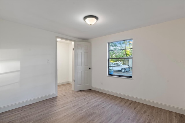 spare room featuring light hardwood / wood-style flooring