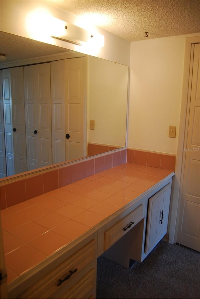 bathroom with a textured ceiling