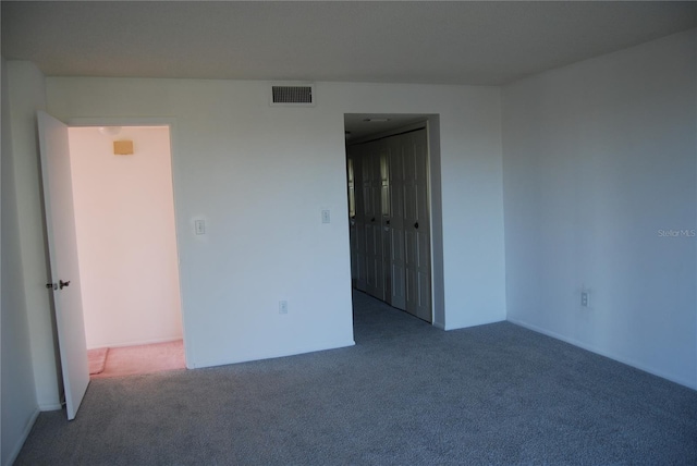 spare room with carpet flooring