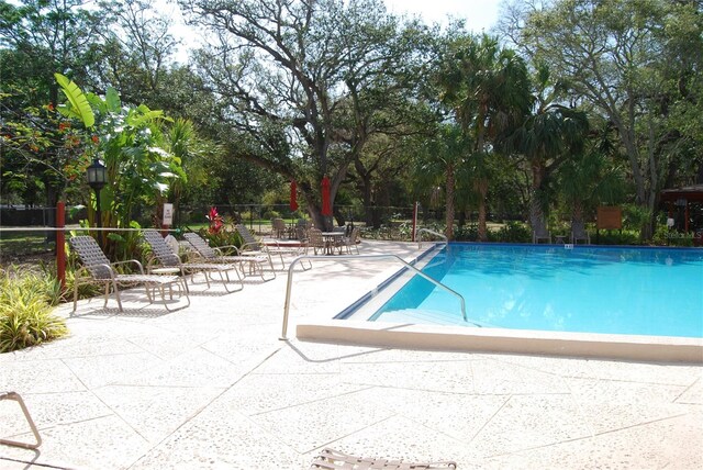 view of swimming pool featuring a patio