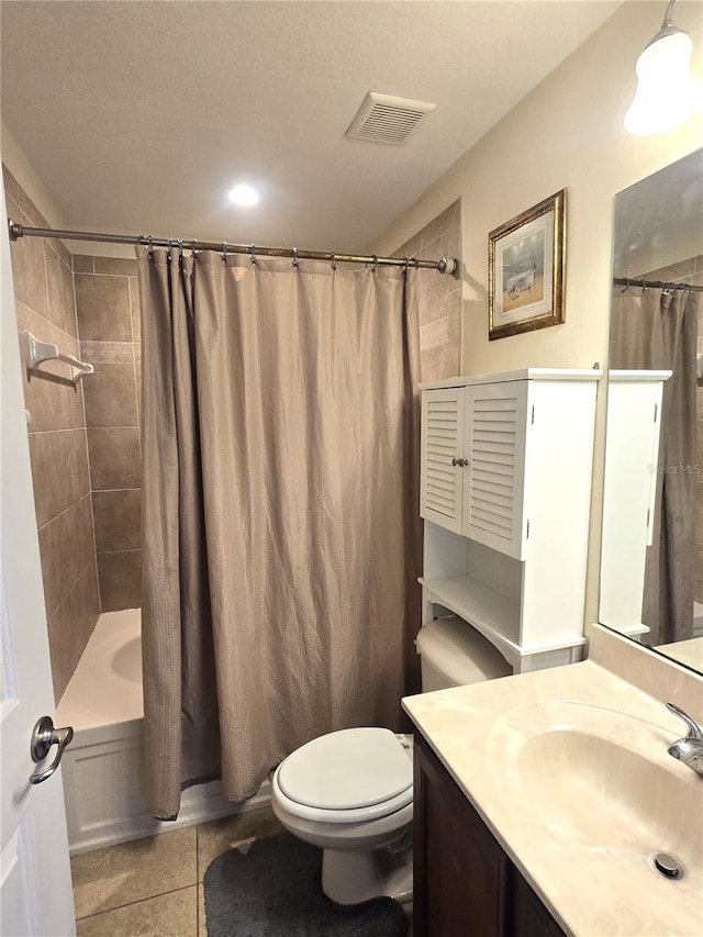 full bathroom featuring vanity, tile patterned floors, toilet, shower / bathtub combination with curtain, and a textured ceiling