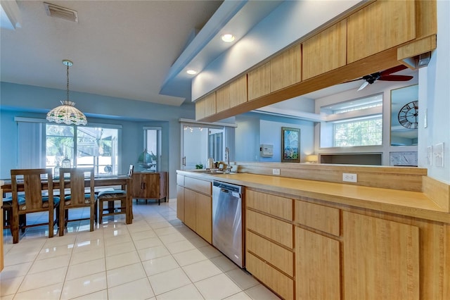 kitchen with pendant lighting, ceiling fan, dishwasher, and a healthy amount of sunlight