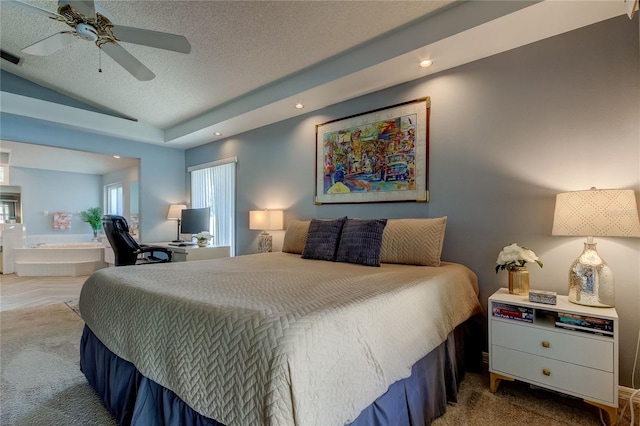 carpeted bedroom with ceiling fan and a textured ceiling