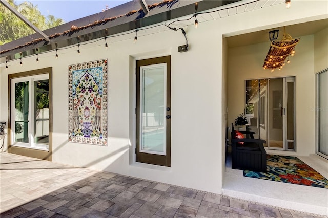 doorway to property featuring a patio