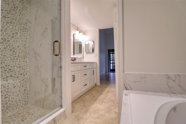 bathroom featuring tile patterned floors, vanity, and an enclosed shower