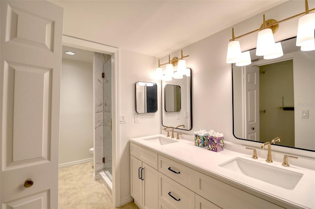 bathroom with vanity and a shower with door