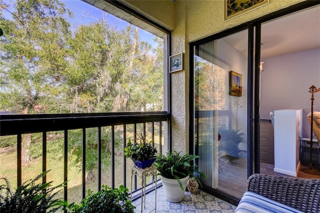 sunroom with a baseboard heating unit