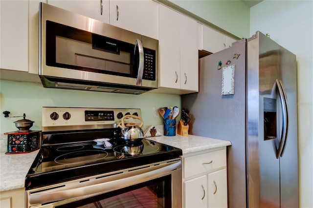 kitchen featuring white cabinetry and stainless steel appliances