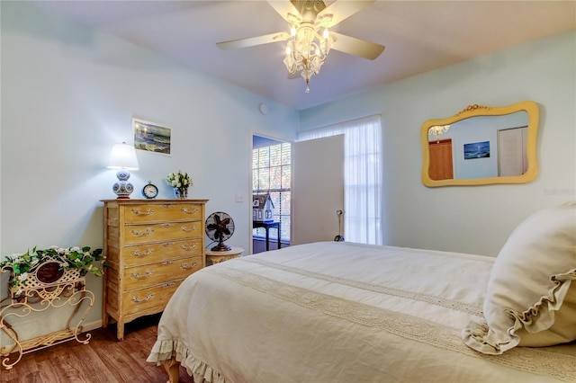 bedroom with hardwood / wood-style floors and ceiling fan