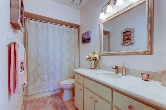 bathroom with toilet, vanity, tile patterned floors, and walk in shower