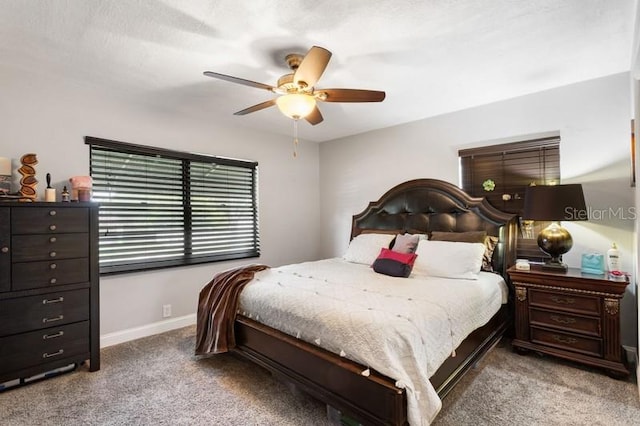 bedroom featuring light colored carpet and ceiling fan