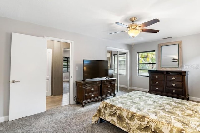 bedroom with light carpet and ceiling fan