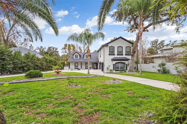 view of front of property with a front lawn