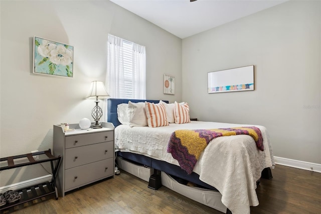 bedroom with dark wood-type flooring