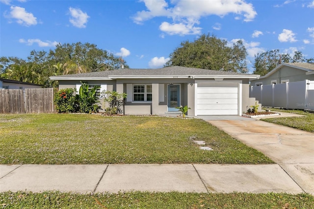 ranch-style house with a front lawn and a garage