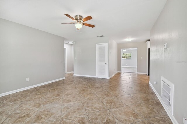 empty room featuring ceiling fan