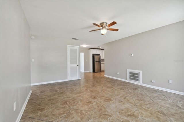 spare room with ceiling fan