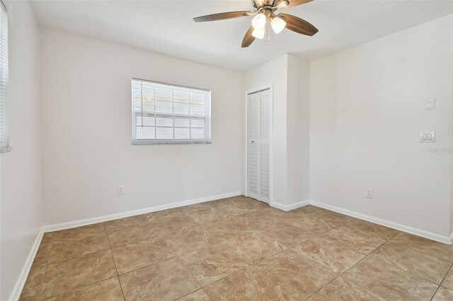 spare room with ceiling fan