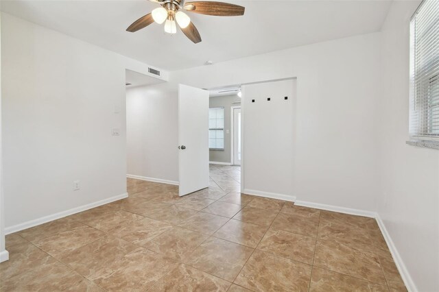 spare room featuring ceiling fan