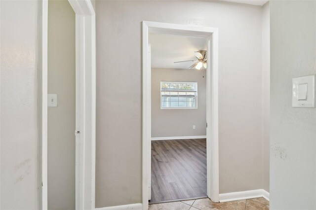 hallway with light hardwood / wood-style flooring