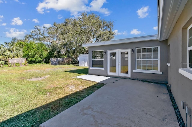 view of yard with a patio and french doors